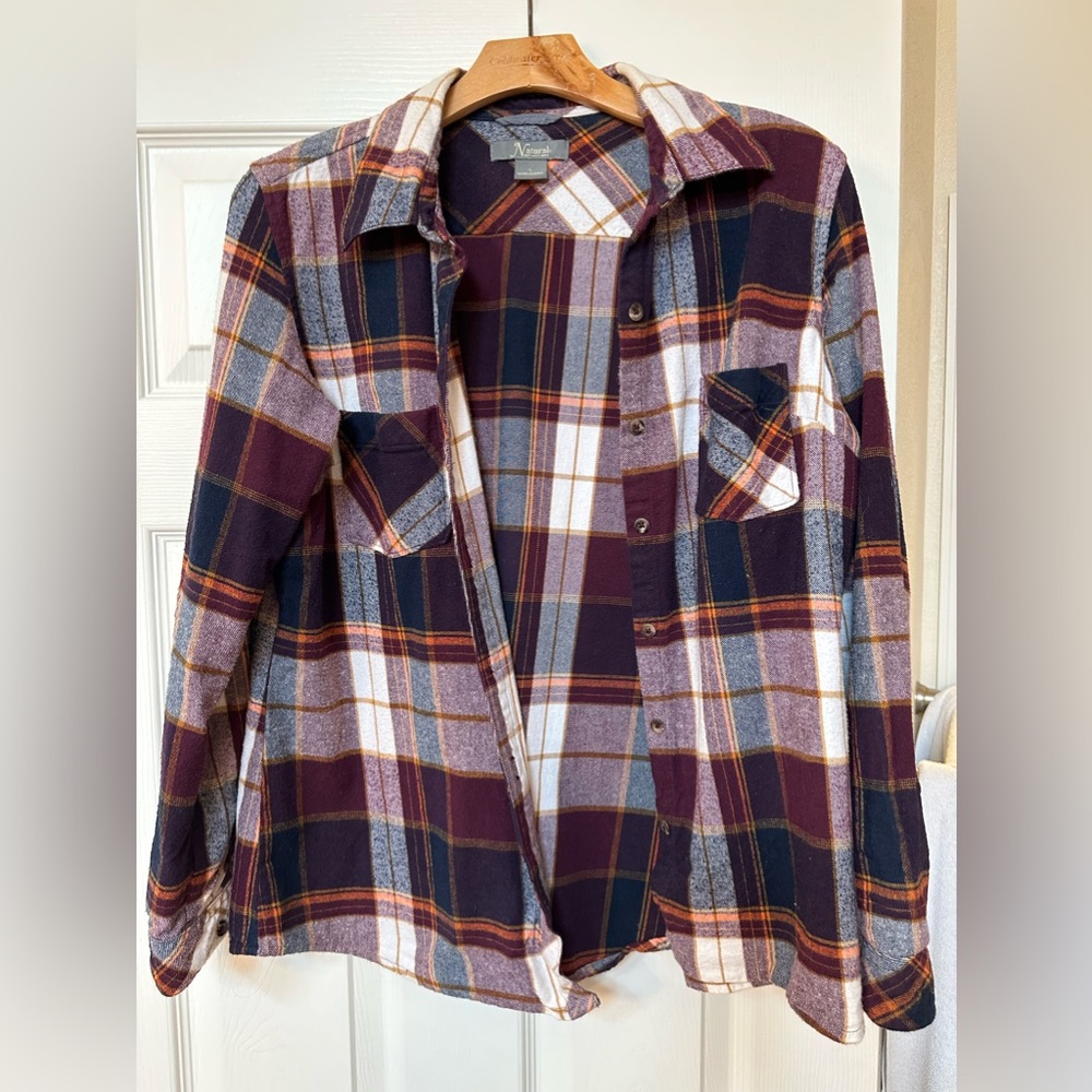 Pretty button down shirt with great coloring. Not worn much. Large, fits smaller